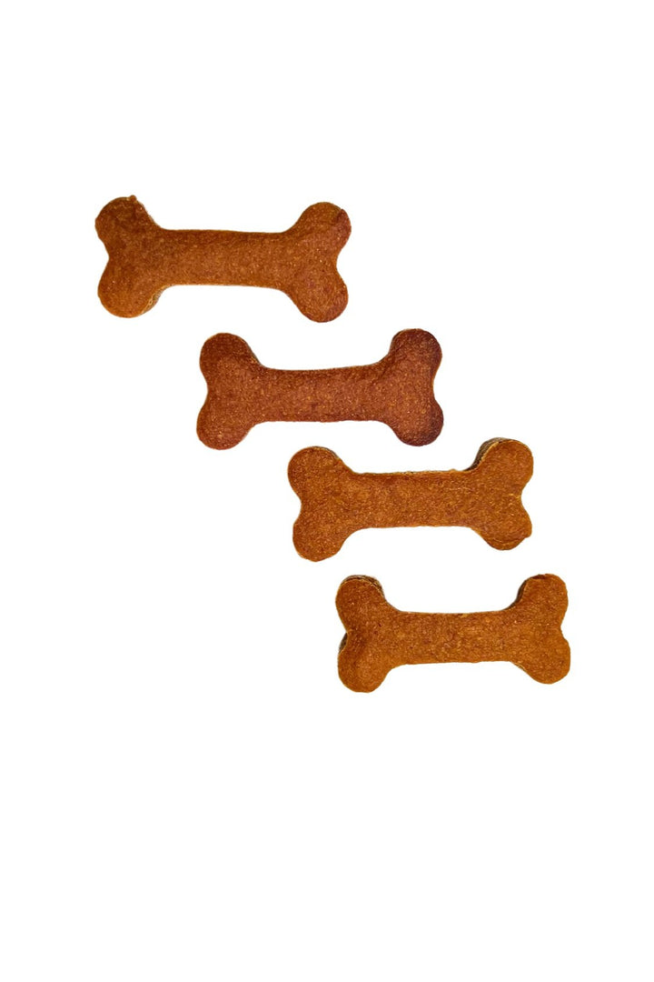 Four honey bones, dog treats made with pumpkin, peanut butter, and honey.