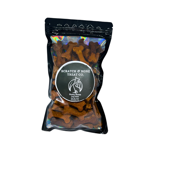 One bag of honey bones, dog treats made with pumpkin, peanut butter, and honey.